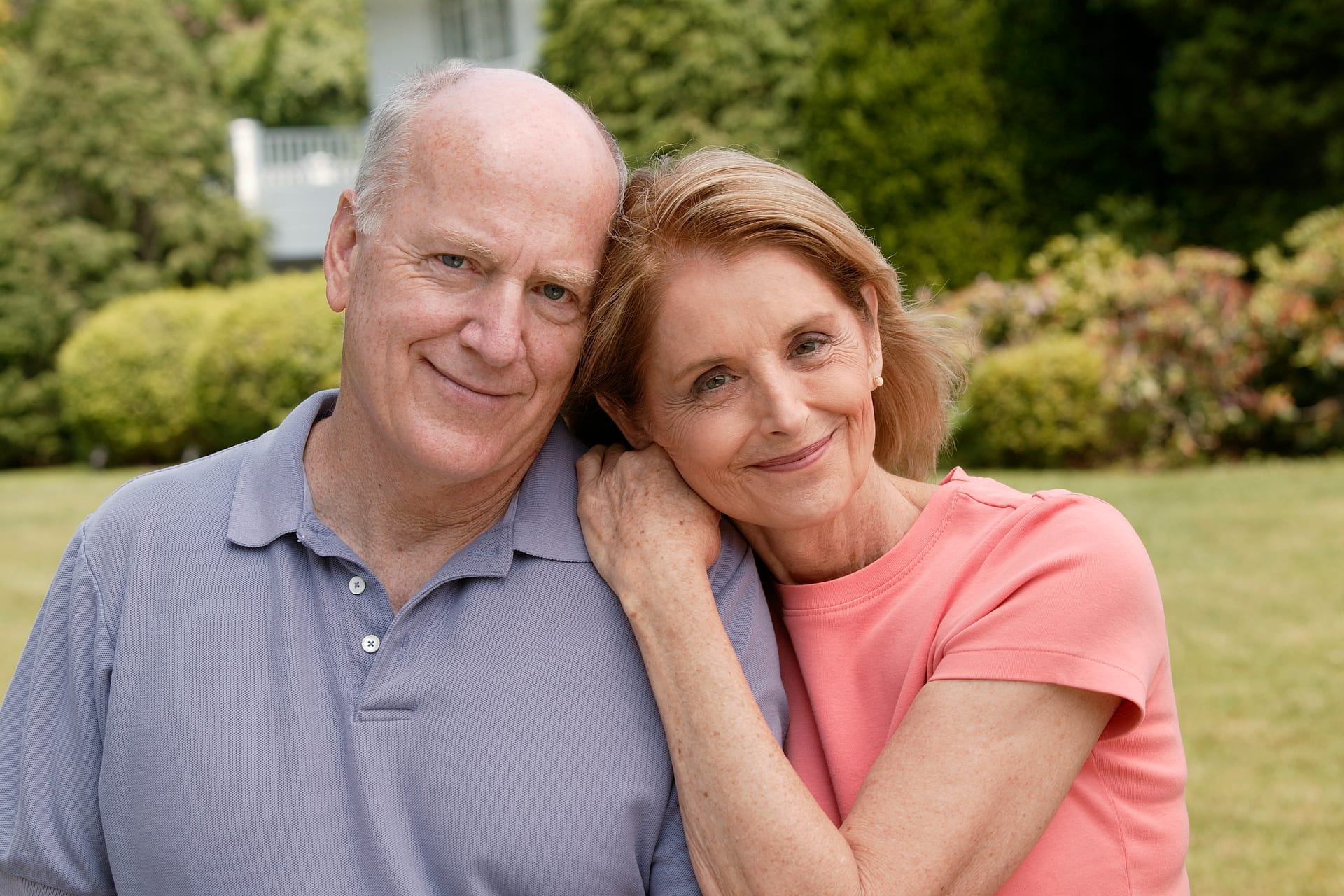 Happy senior couple embracing and smiling